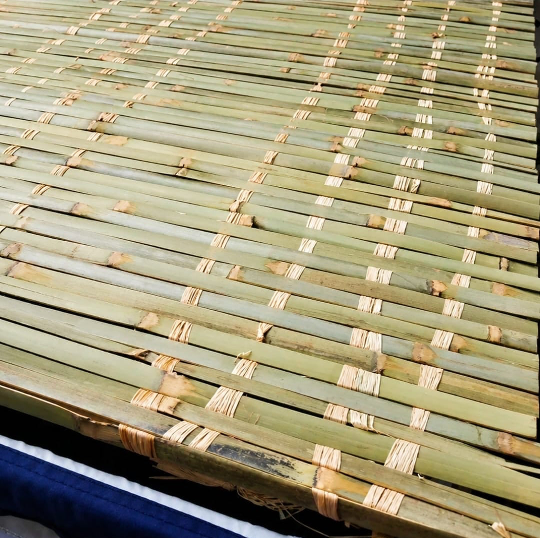 A close-up of a woven bamboo chess mat with light tan binding strips, shown above a text label reading 'Bamboo Schach Mats' on a white background.